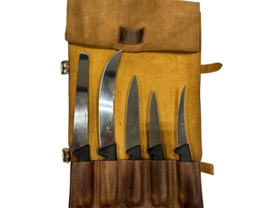 A professional hunting and butchering knife set neatly stored in a rugged leather roll—built for durability, protection, and convenience in the field.