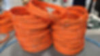 Stacks of premium Jarvis Canada bandsaw blades, coiled and labeled for precision meat processing. Engineered for durability and clean cuts.