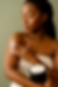 Body Butter Application in Soft Light.png