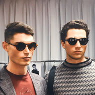 Two male models wearing sunglasses