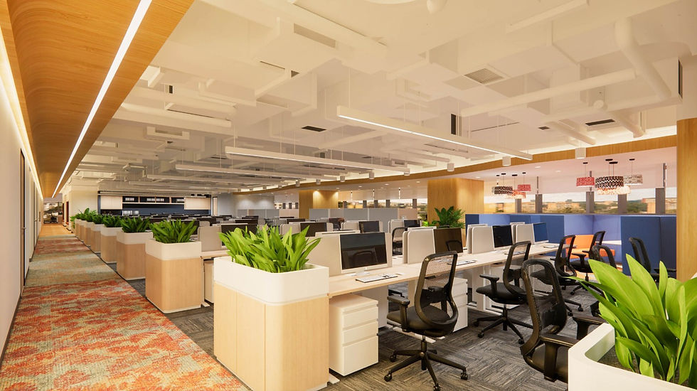 Modern open office space with rows of desks, black chairs, computers, and green plants. A patterned rug and ceiling lights add warmth.
