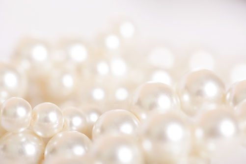Pile of pearls on the white background.jpg