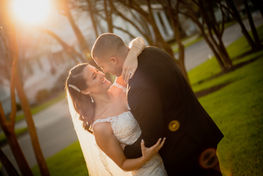 sunset rays following through the trees on wedding couples