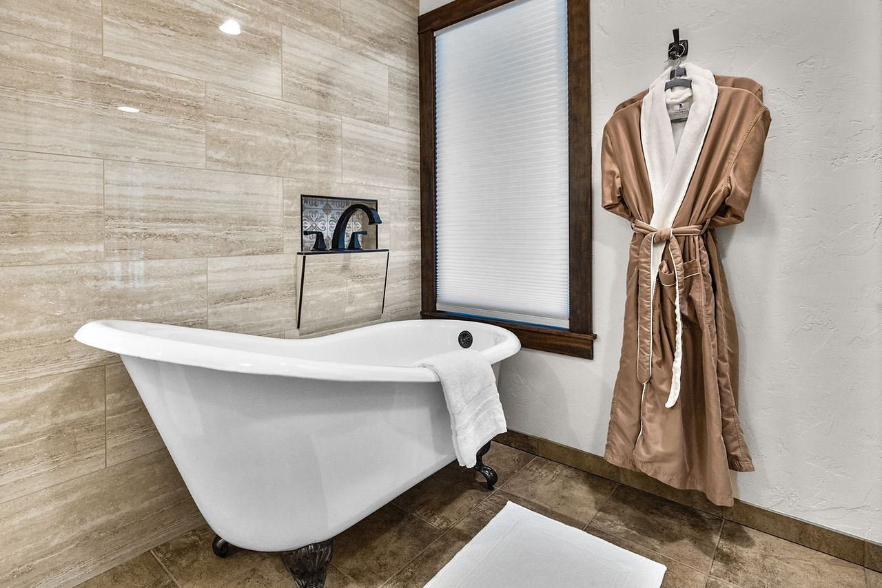 Somers House: freestanding tub and stone-tile walls