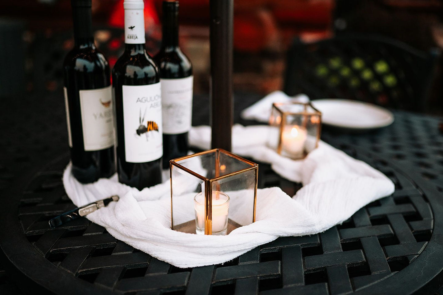 Wine and lanterns set out for an evening on the terrace