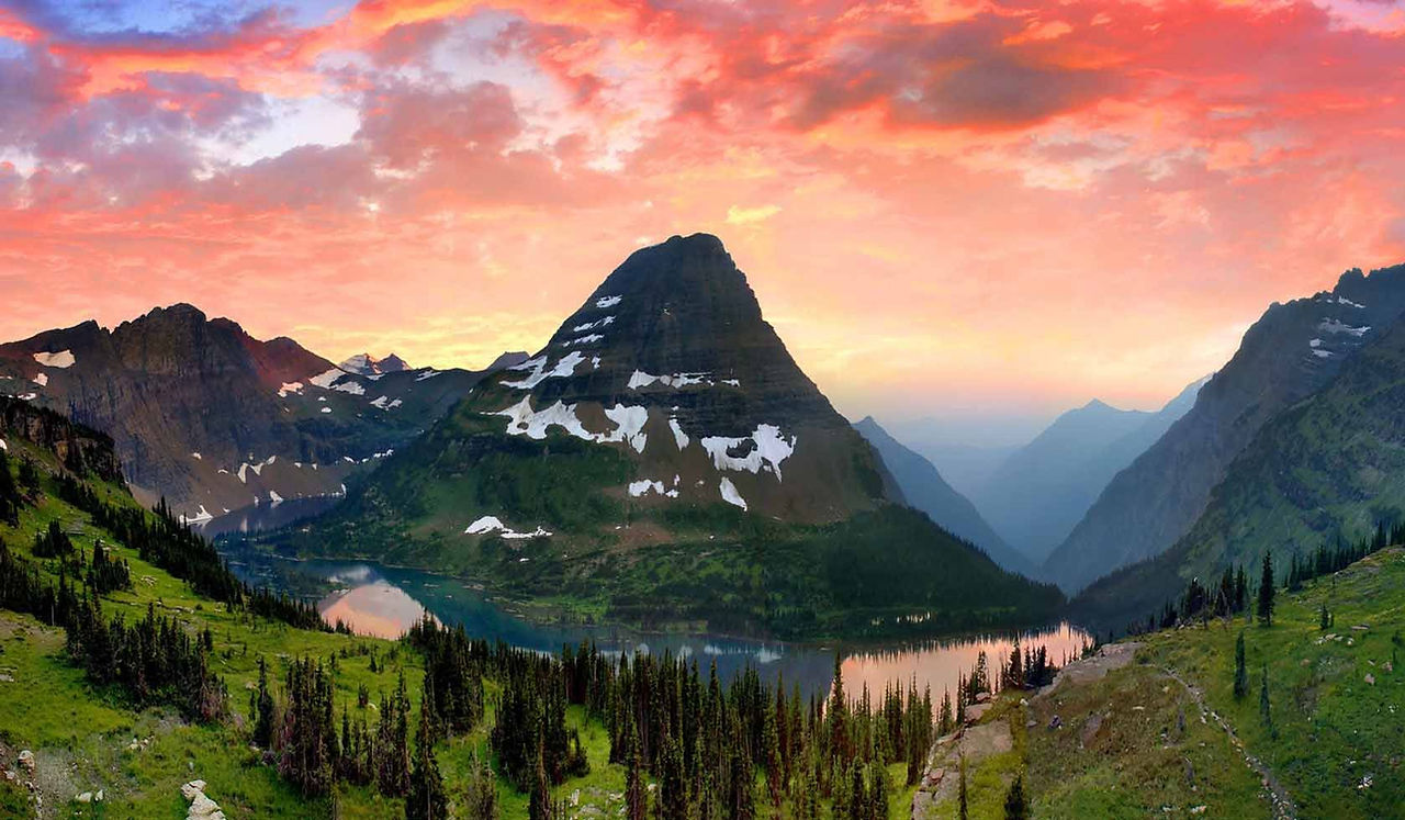 Valley at sunset with a snow-dusted peak