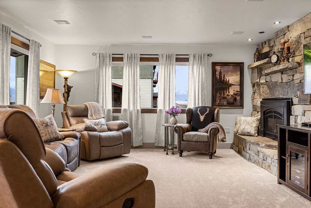 Somers House: sofas, fireplace and framed art in the living room