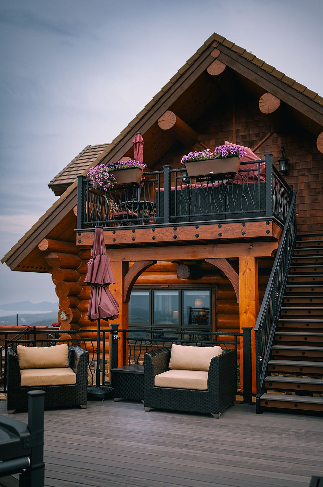 Suite balcony with flower boxes and outdoor seating