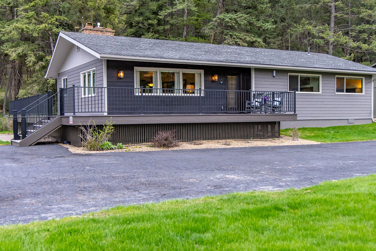 Somers House with its dark deck and gravel drive