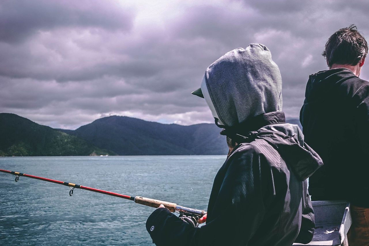 Fishing from a boat on a mountain lake