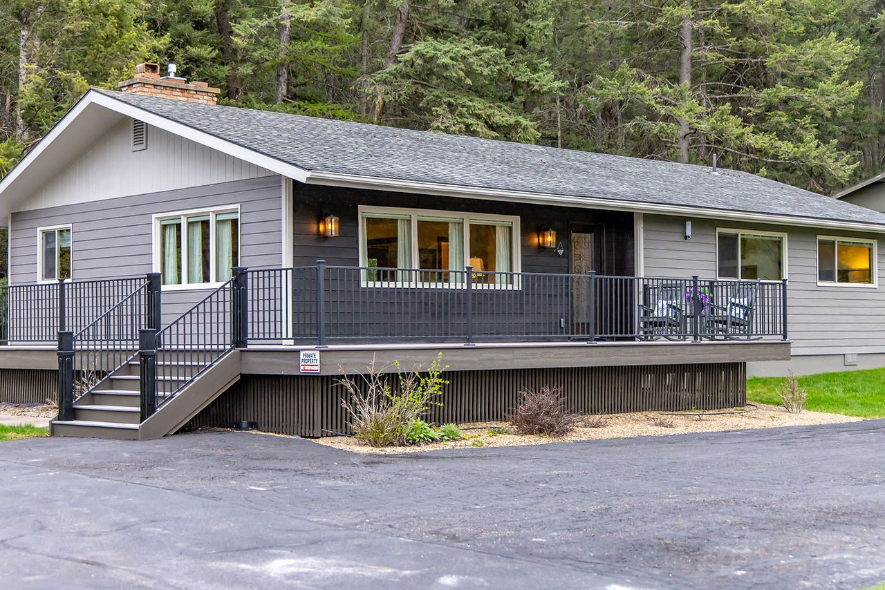 Somers House: gray cottage with porch steps set among trees