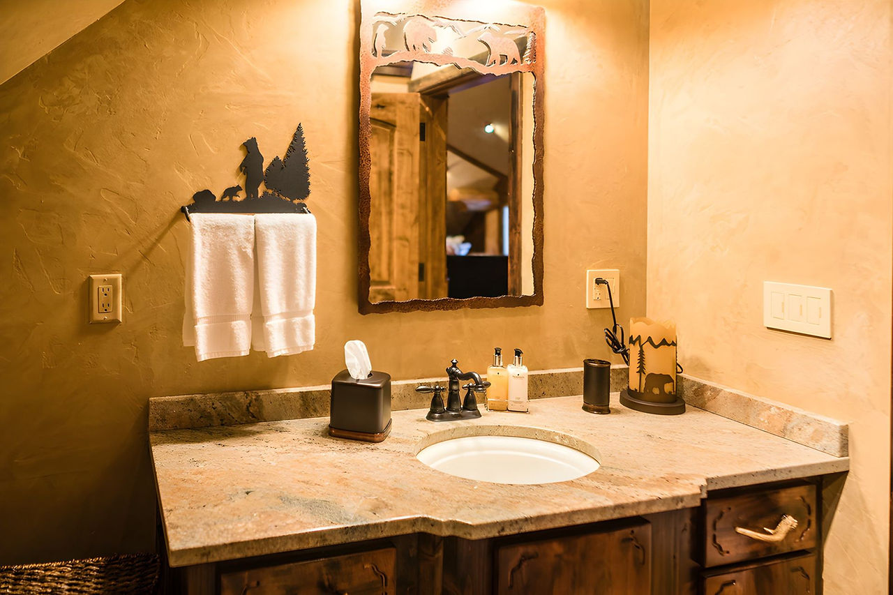 Granite vanity and mirror in the Yellowstone Suite bath