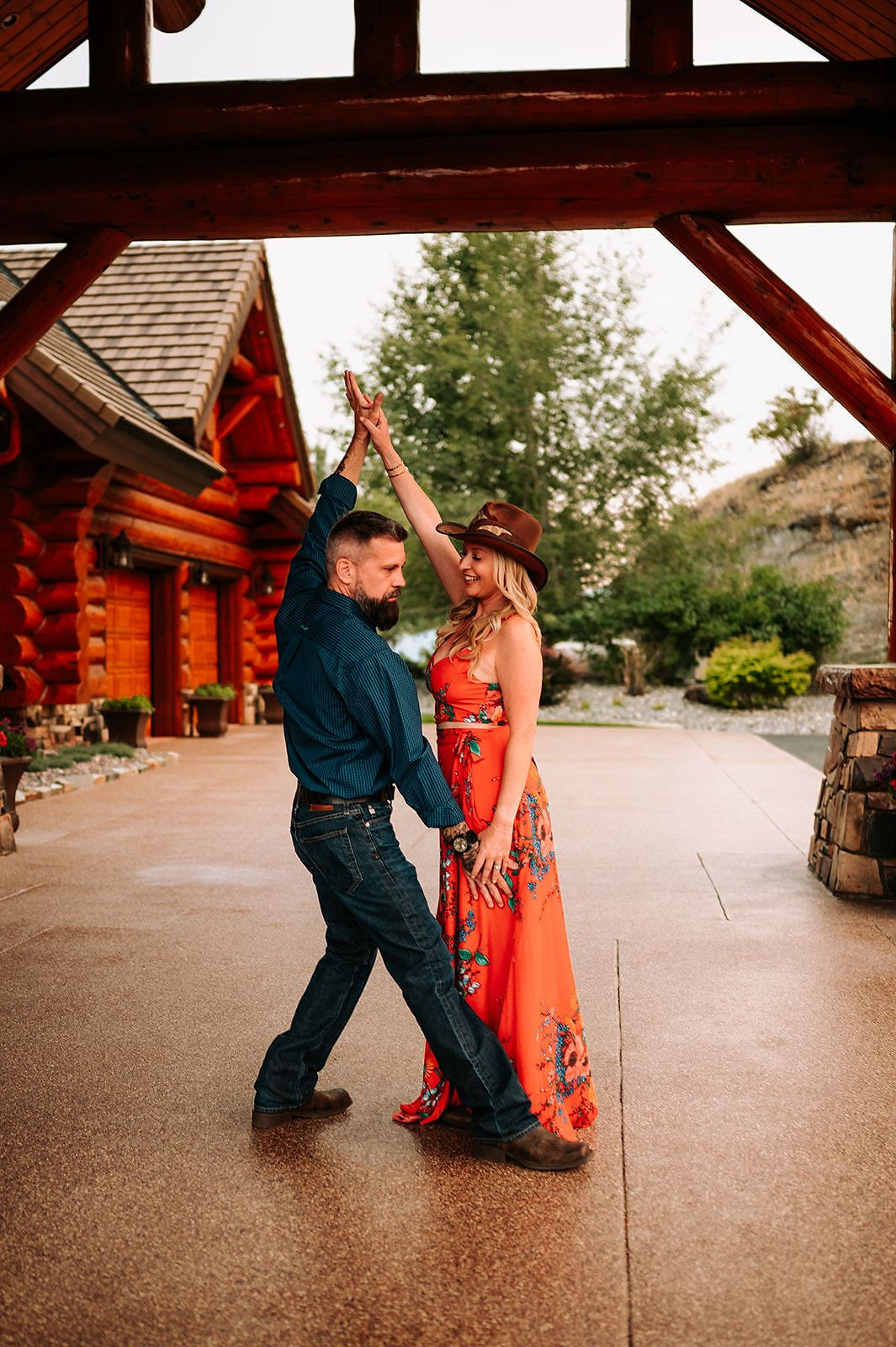 A couple dancing beneath the timber archway