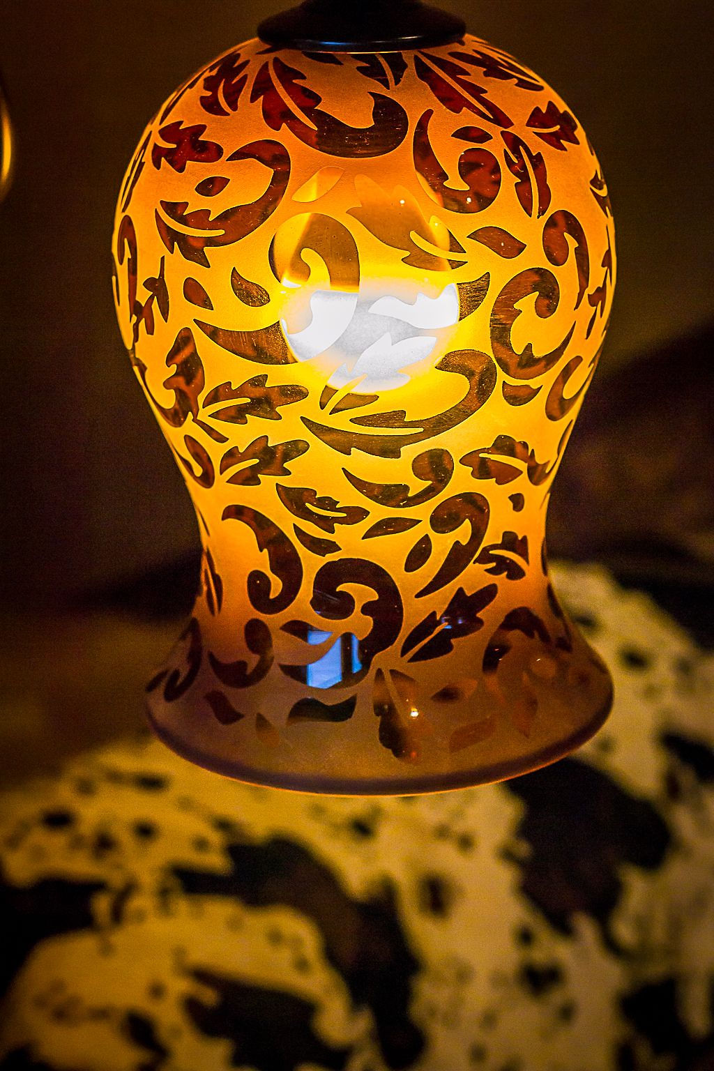 Close-up of an ornate amber lamp