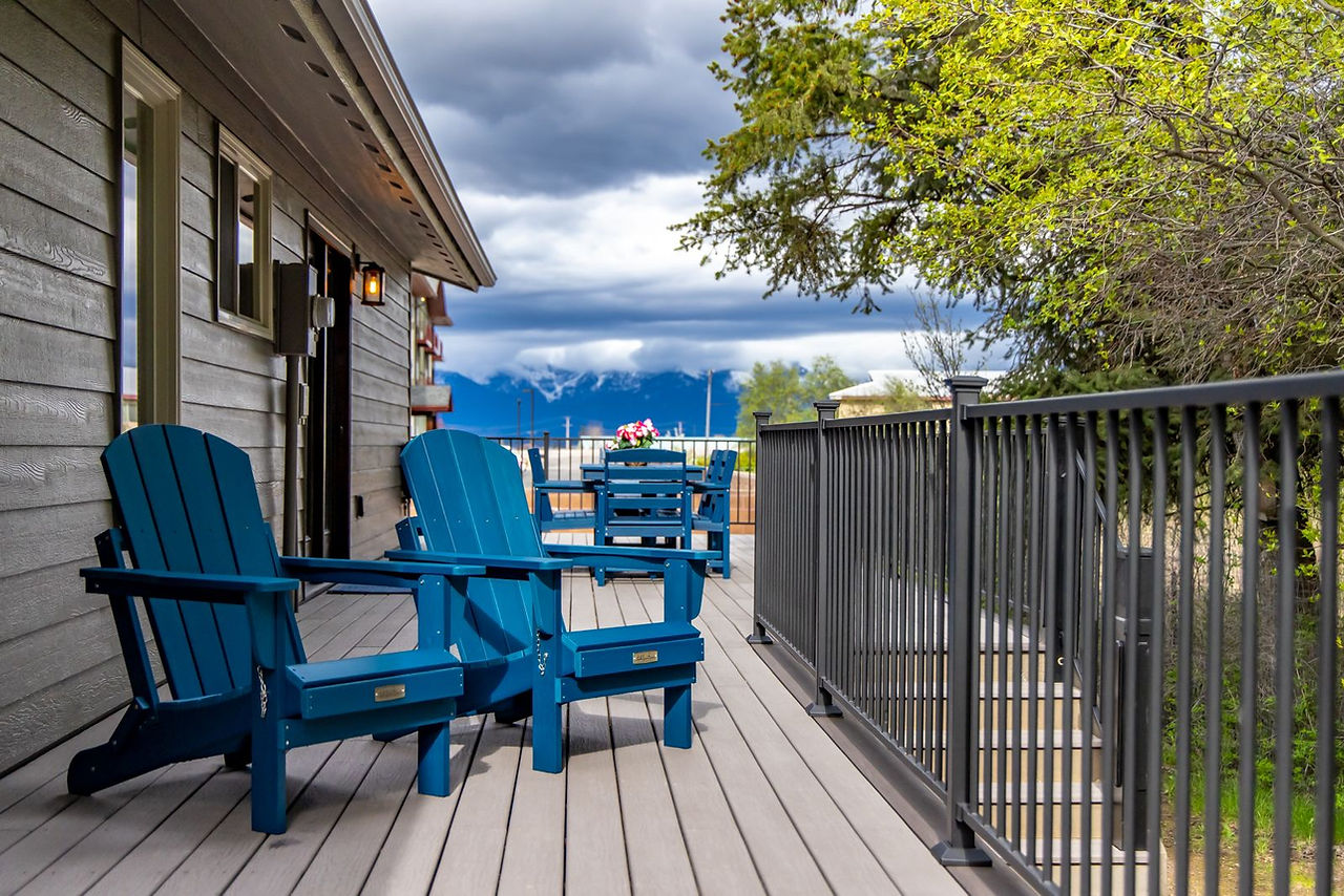 Somers House: blue Adirondack chairs on the deck facing the mountains