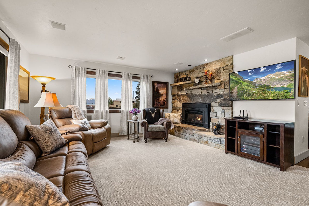 Somers House: leather sofas, stone fireplace and bay window