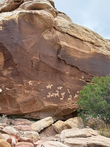 Petroglyphs in red sandstone at the start of Delicate Arch