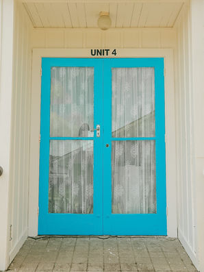 Striking Blue Entry Door To Unit 4 Of Glacier Country Motel