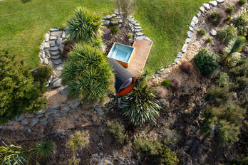 Birds Eye View Of Barrel Sauna With Viewing Window And Spa Pool