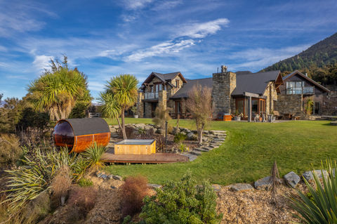 Lake Hawea View Luxury Lodge In New Zealand With Wellness Area Including Outdoor Barrel Sauna And Spa Pool Front View