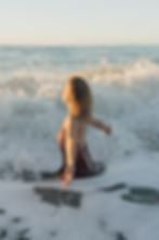Life-Coach-Judith-Buel-Sitting-In-Ocean-West-Coast-NZ.jpg
