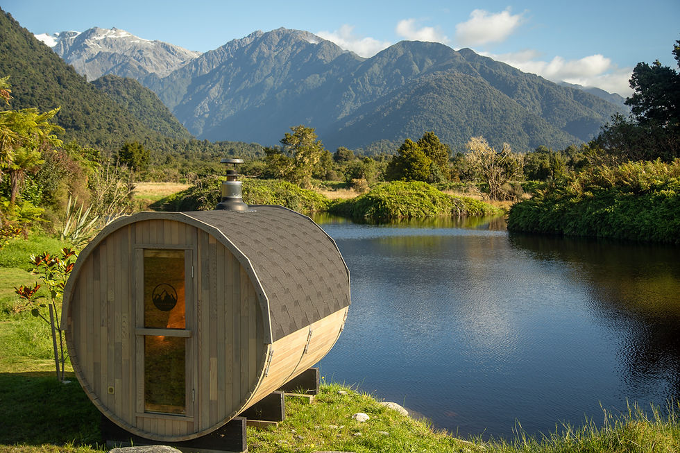 Woodfired Large Barrel Sauna On Edge Of Lake With The Southern Alps Of New Zealand In The Background