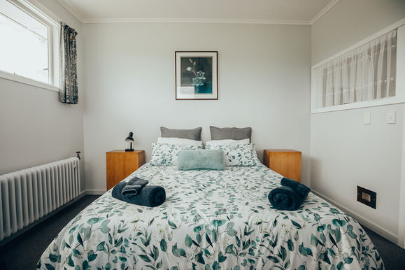Queen Motel Room Freshly Decorated In White And Pale Blue.
