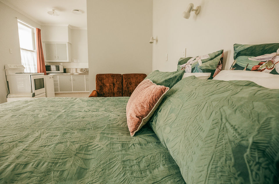 Large Bed In Self Contained Motel Room With Kitchen