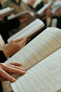Music scores in people's hands