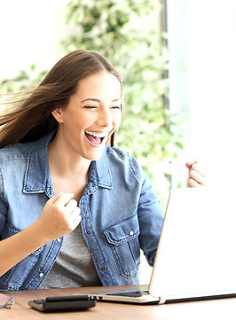 EXCITED WOMAN on computer blue jacket_ed
