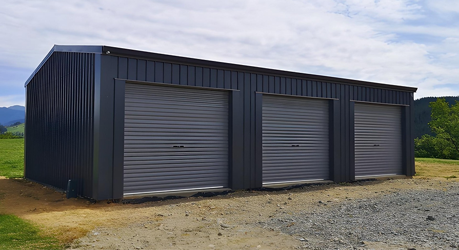 Custom shed build in Nelson with multiple roller doors for workshop and storage use