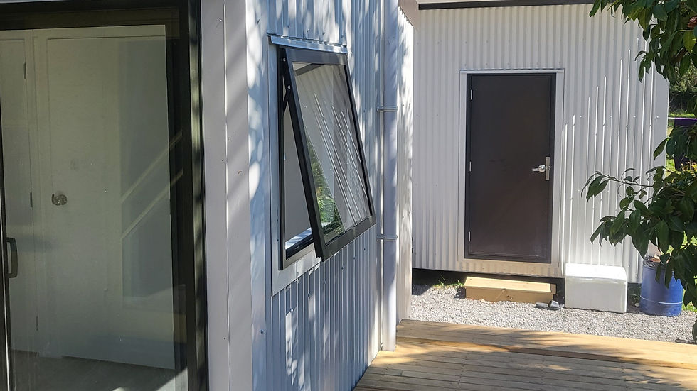 Modern custom cabin build in Richmond with cladding and large windows