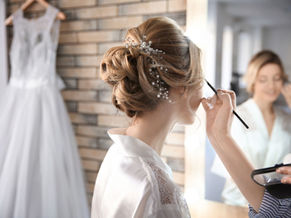 Bride having her makeup applied on her wedding morning, supporting Luminous Skin’s wedding skin planning guide for Nelson and Tasman.