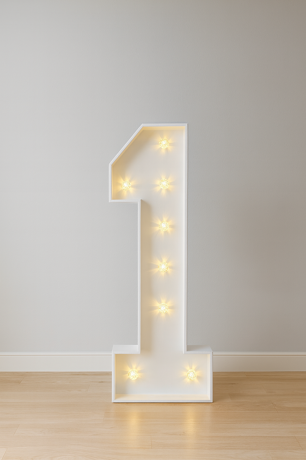 A large, freestanding white number "1" with warm white light bulbs illuminated inside it.