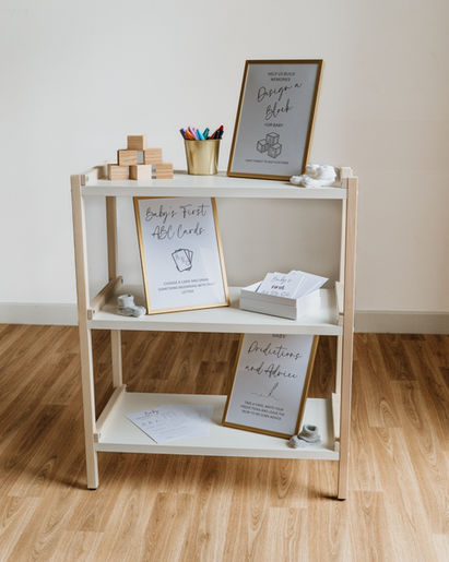 A stylish white A-frame shelving unit for hire, perfect for displaying signs, favours, or creating a gift station at a baby shower, christening, or party.