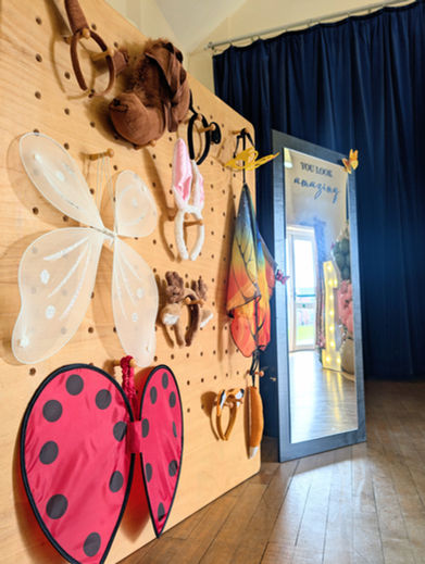 Peg board featuring enchanted woodland theme kids dress up and child floor length mirror.