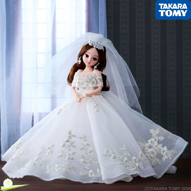 Licca-chan in a Magnolia-inspired wedding dress, shown indoors with sunlight through a large window and a wistful expression.