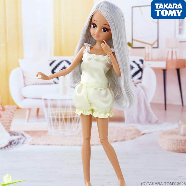 Front full-body view of Photogenic LiccA Lily doll in pale yellow outfit, posing with a gentle twist before a stylish diorama