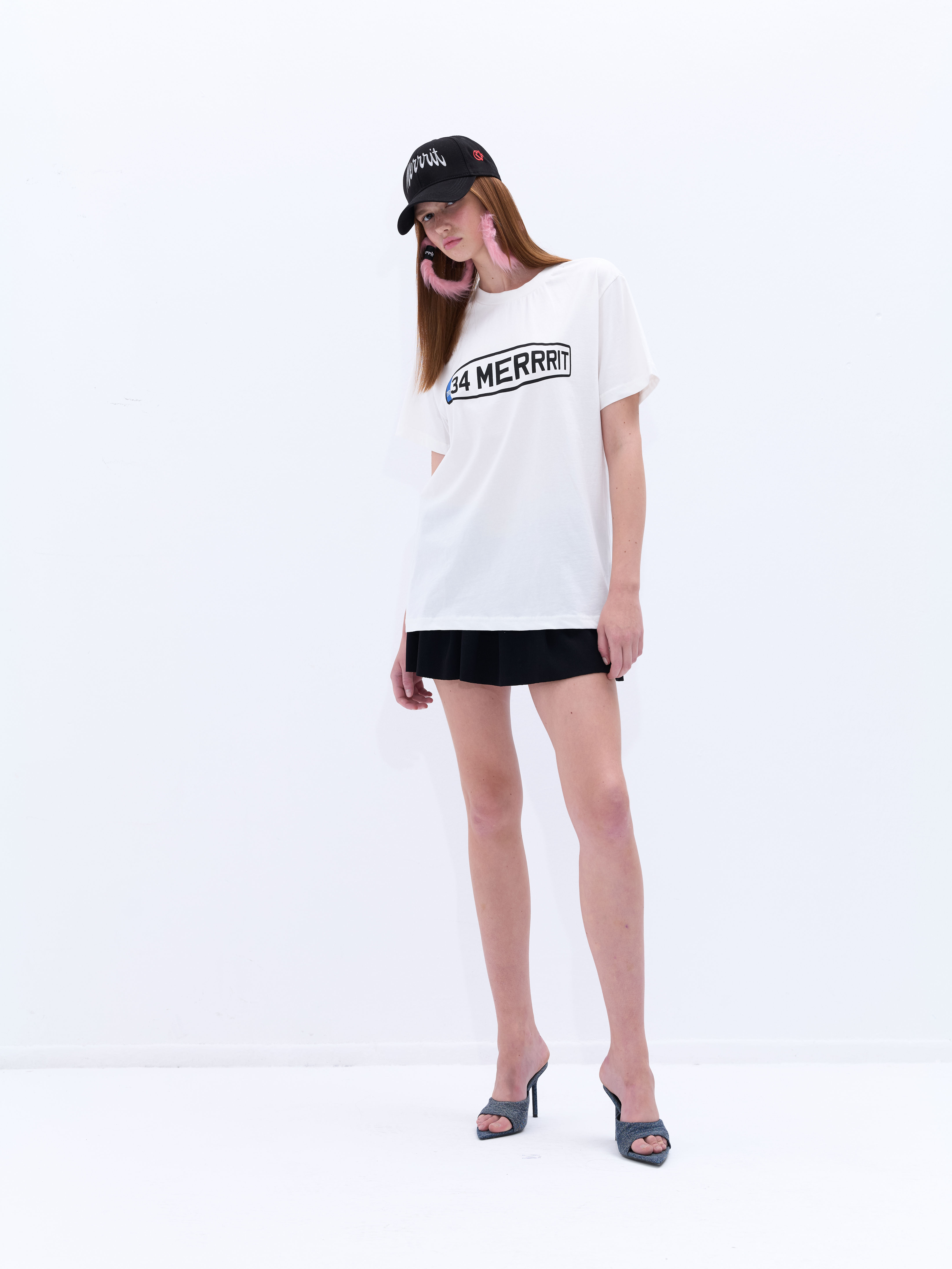 Model is wearing Plaka White Tee.