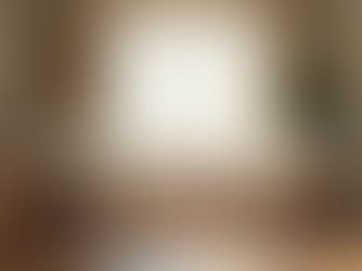 Eye-level view of a cozy therapy room with two chairs facing each other