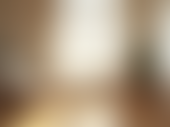 Eye-level view of a quiet room with soft natural light and a comfortable chair