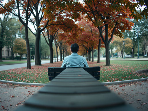 एउटा शान्त ठाउँमा बसेर गहिरो सोचमा डुबेको पुरुष, जसले विश्वासघातपछिको मानसिक आघातलाई संकेत गर्छ।