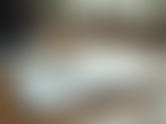 Eye-level view of a journal and pen on a wooden desk symbolizing mental health reflection