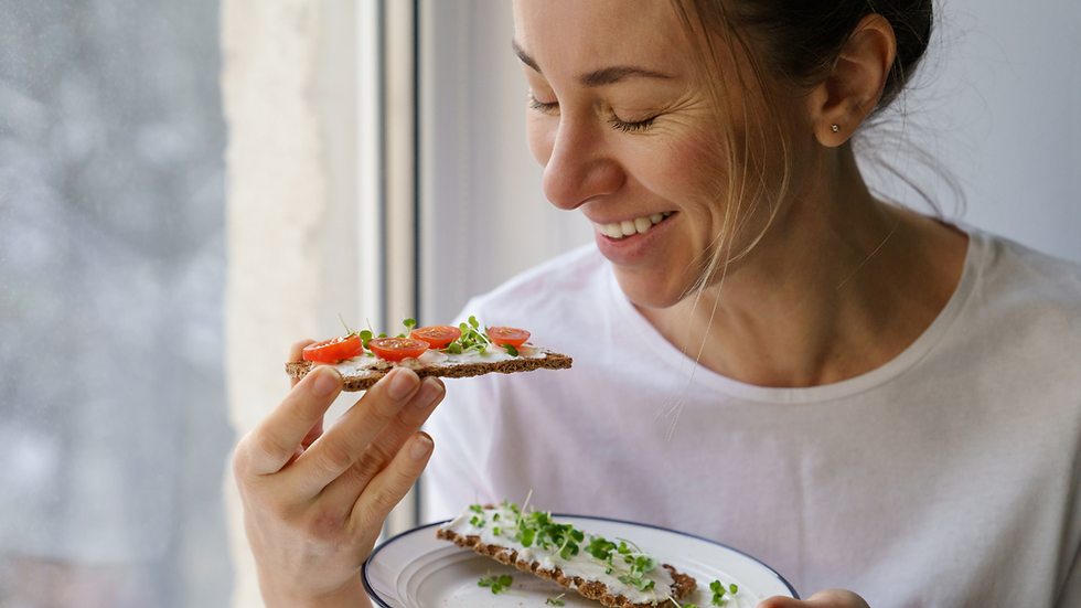Woman eating a gluten free toast