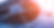 Close-up of a metal fan grille with dynamic blue and orange lighting,