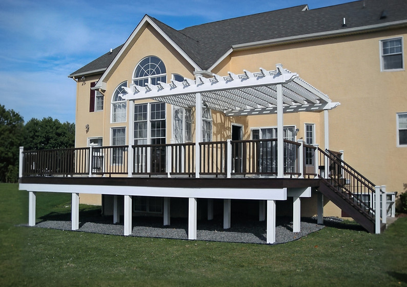 Custom deck with custom pergola design in white pvc
