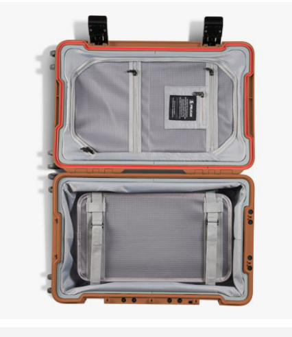 Close-up view of Pelican ATX 22 Carry-On interior compartments with organized travel items