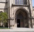 Close-up on the church's entrance, where the porch-tower visibly leans