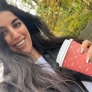 Me having a coffee from Sant Ambroeus cafe in Central Park, NYC