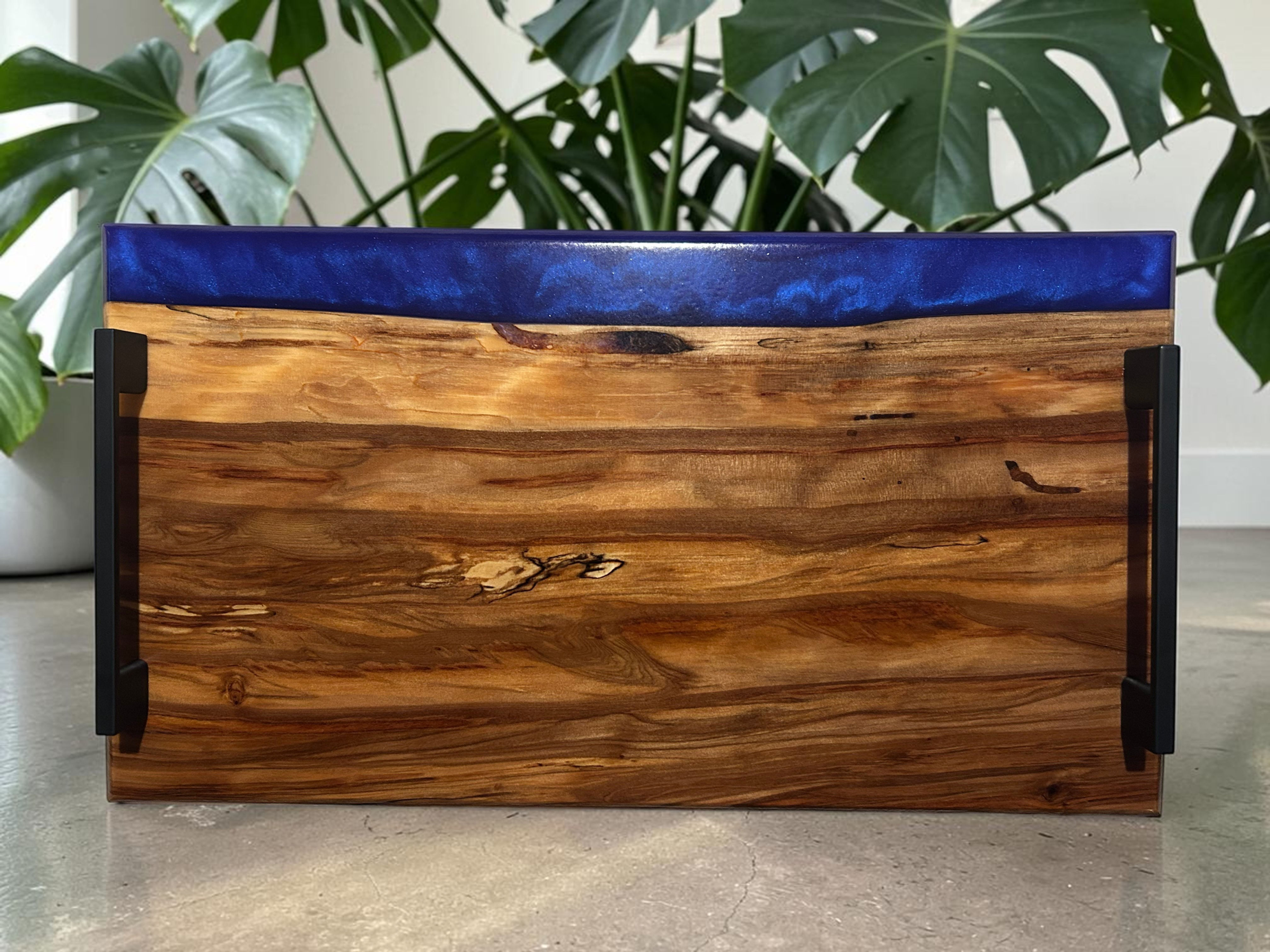 Sugar Gum charcuterie board accented with blue/purple resin